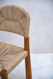 Handcrafted teak wood chair with natural character

