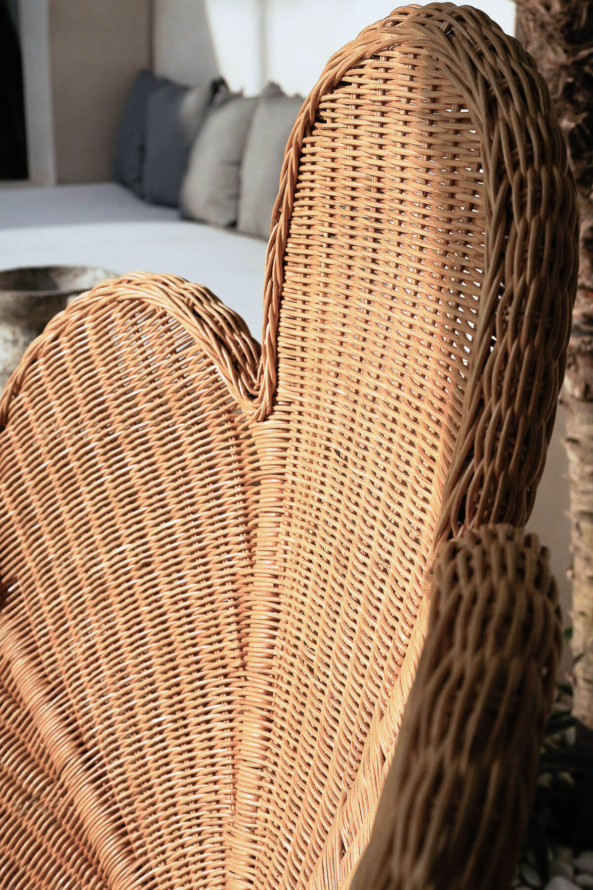 Rattan lounge chair with woven backrest detail
