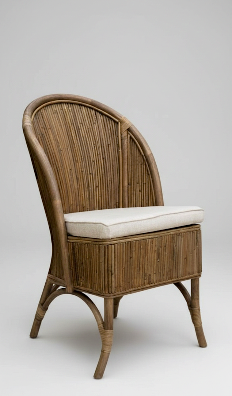 Wicker chair with a white cushion on a gray background