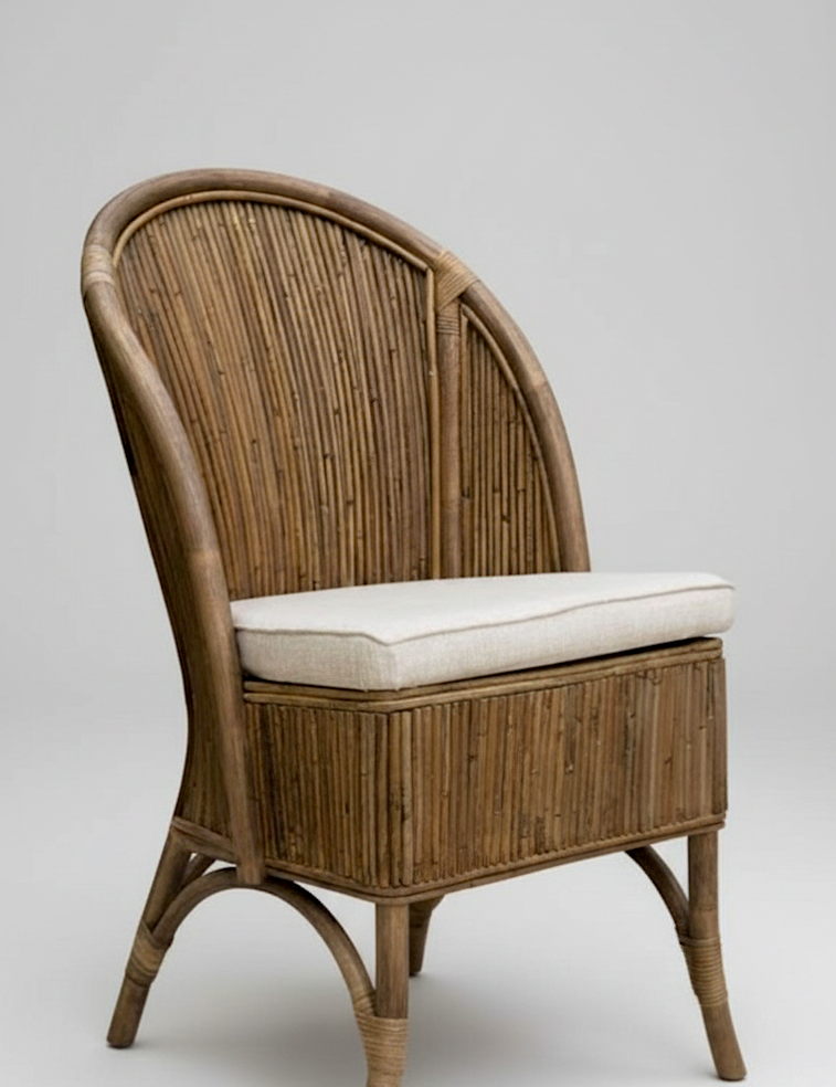 Wicker chair with a white cushion on a gray background