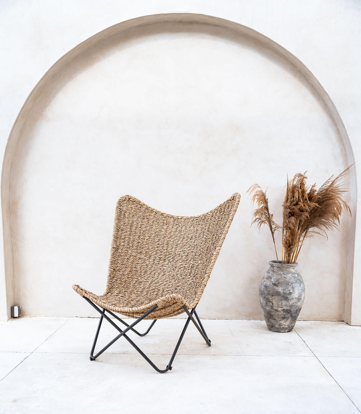 Modern synthetic rope lounge chair with open frame
