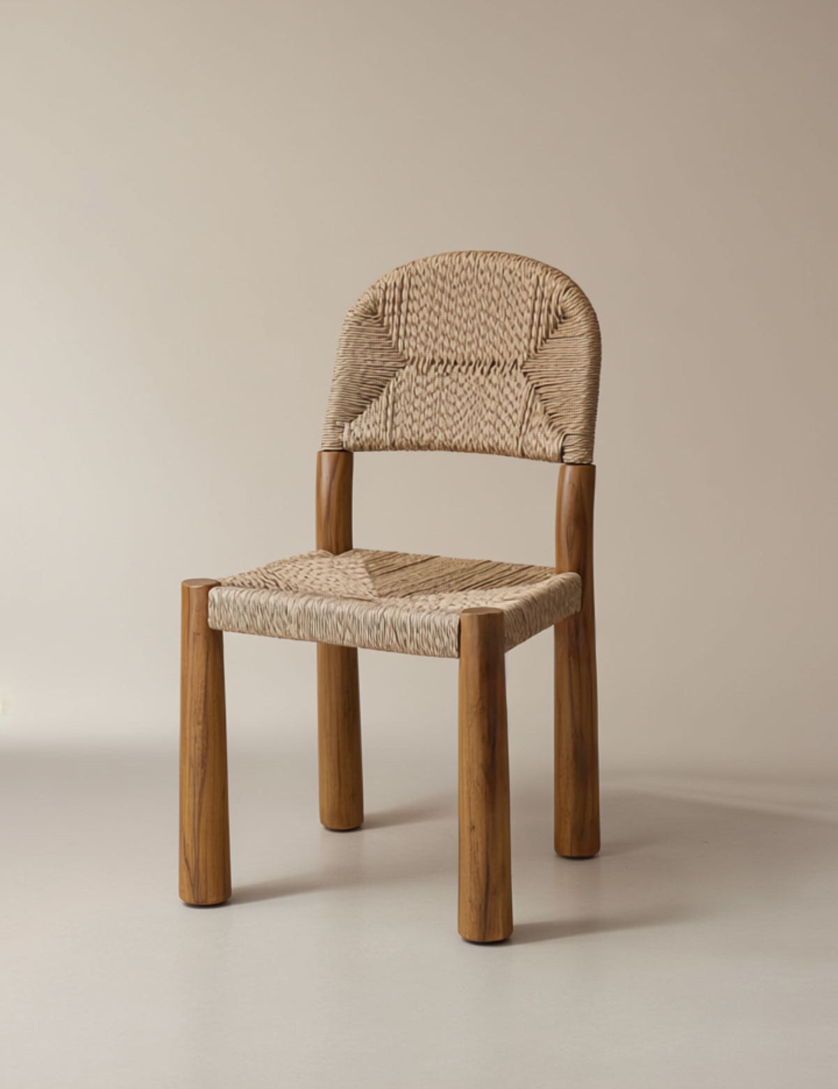 Wooden chair with woven seat and backrest on a beige background