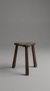 Wooden stool on a gray background