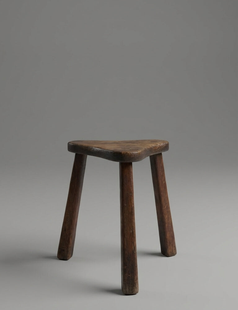 Wooden stool on a gray background