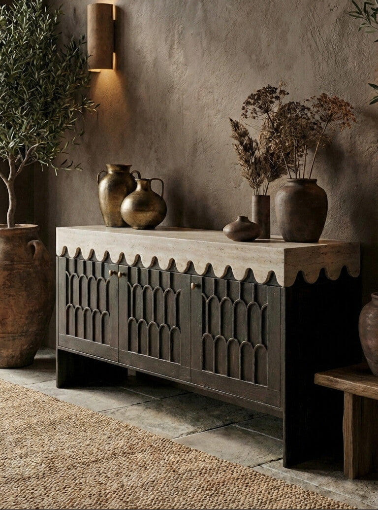 Wooden sideboard with decorative vases against a textured wall.