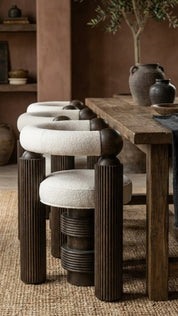 Sculptural teak wood chair with curved legs
