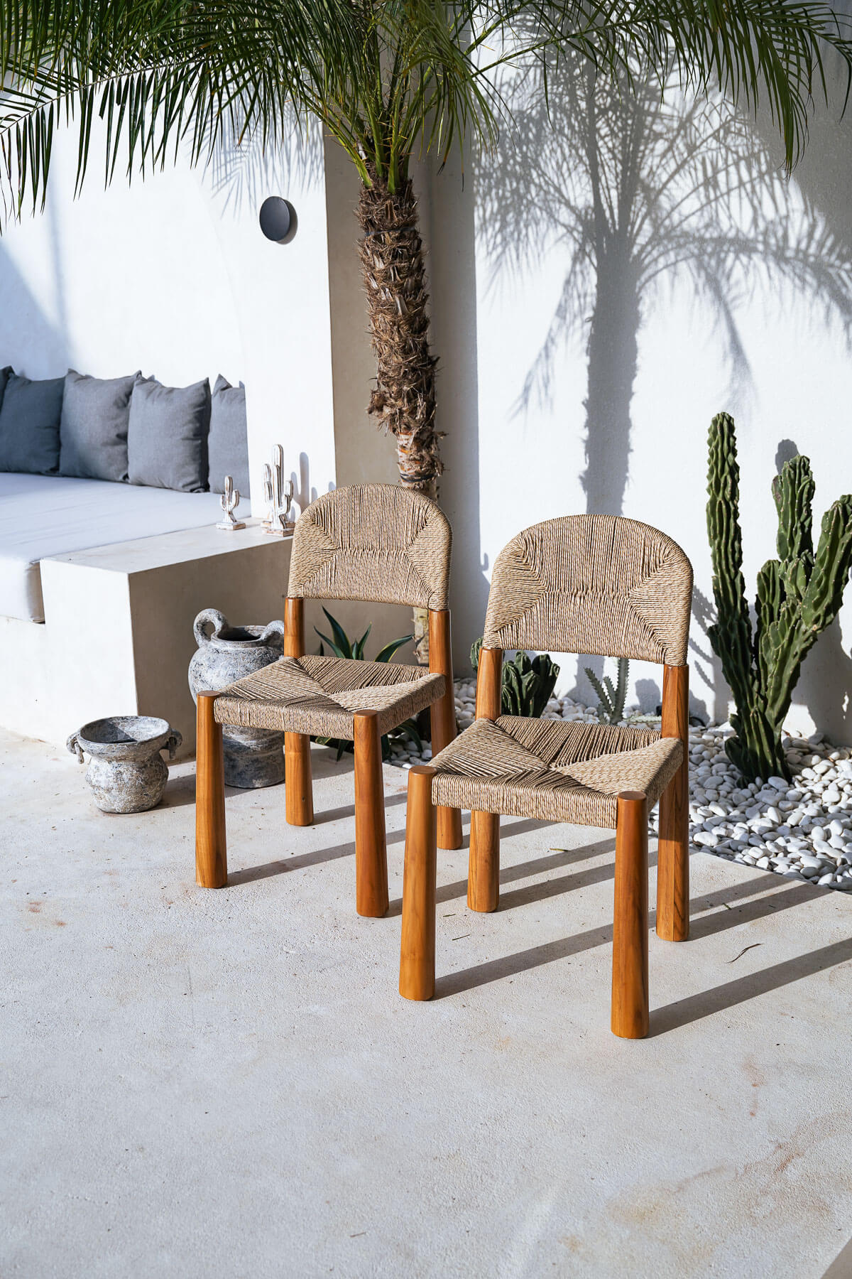 Teak wood chair styled in coastal interior
