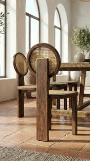 Teak wood dining chair with elegant proportions
