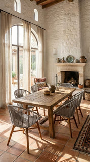 Dining room with wooden table and chairs in a rustic setting