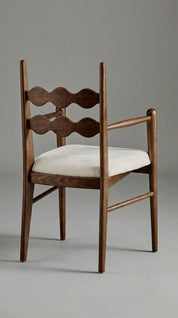 Teak wood armchair with visible grain texture
