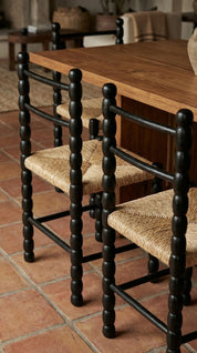 Teak wood dining chair with sturdy construction
