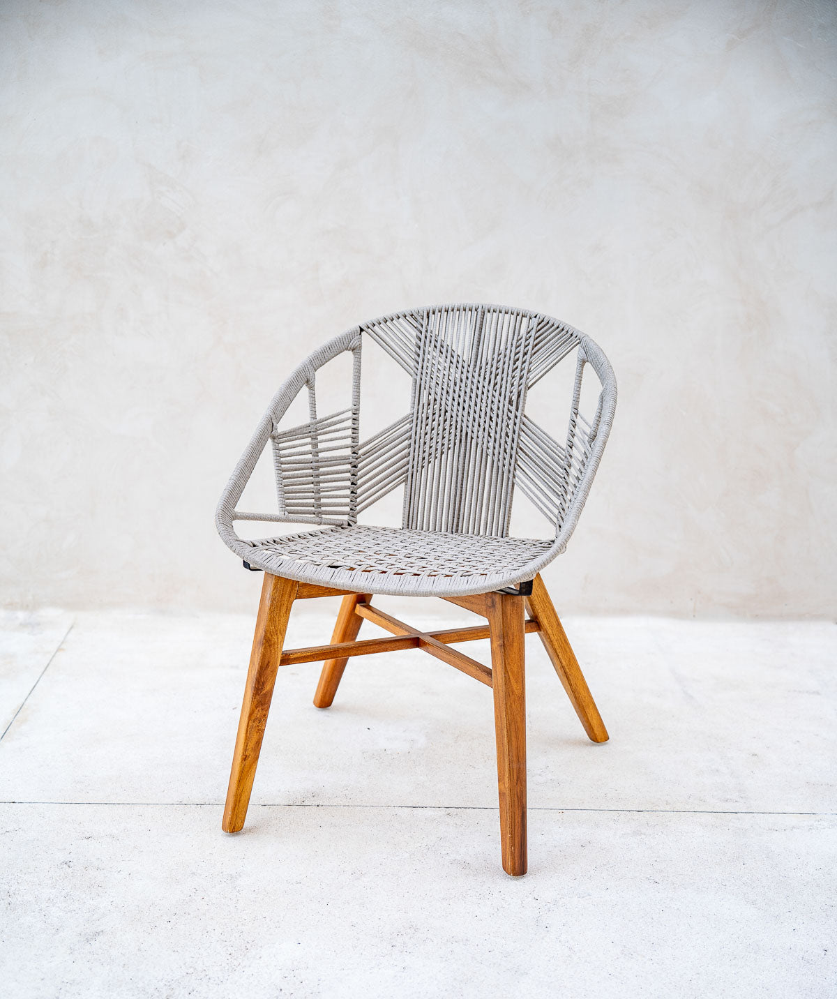 Solid teak wood chair styled in the living room
