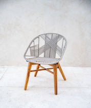 Solid teak wood chair styled in the living room
