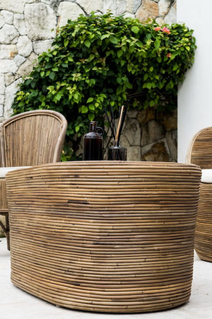 Tegal Oval Rattan Table in rich brown finish, handwoven from durable natural rattan for indoor or outdoor use