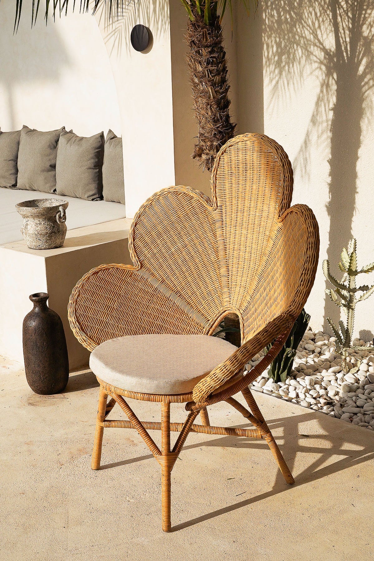 Wicker chair with a cushion in an outdoor setting