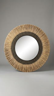 Round mirror with a natural woven frame on a gray background