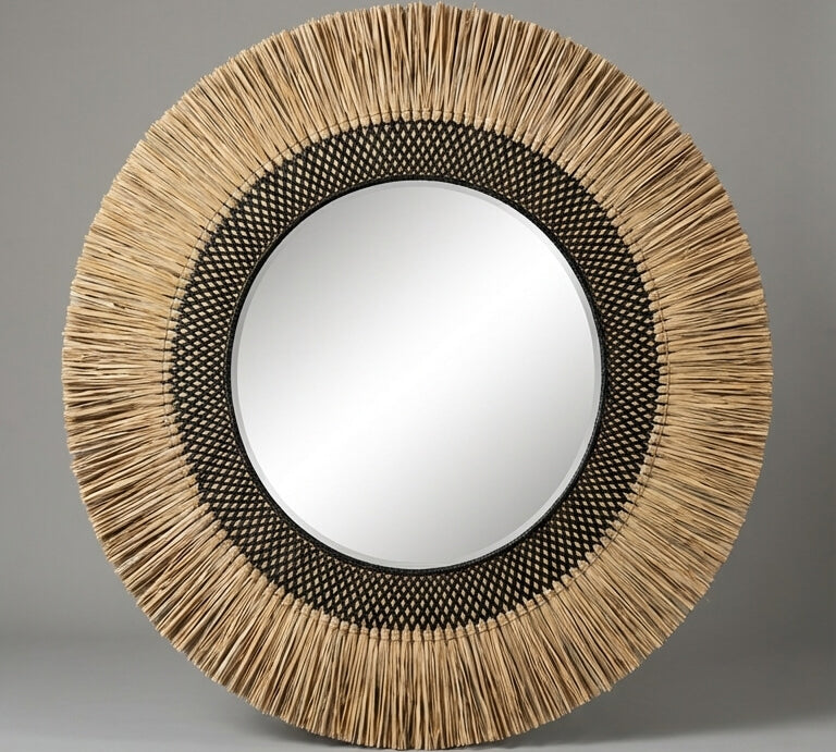Round mirror with a natural woven frame on a gray background