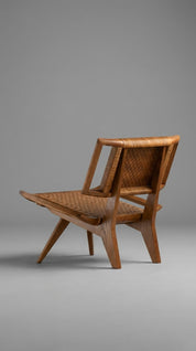 Teak wood accent chair placed in living space
Sculptural teak wood armchair in modern room