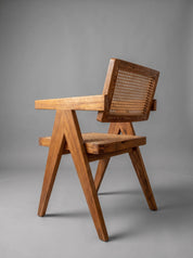Back detail of solid teak wood chair
Teak wood armchair with natural finish
Modern organic teak wood dining chair