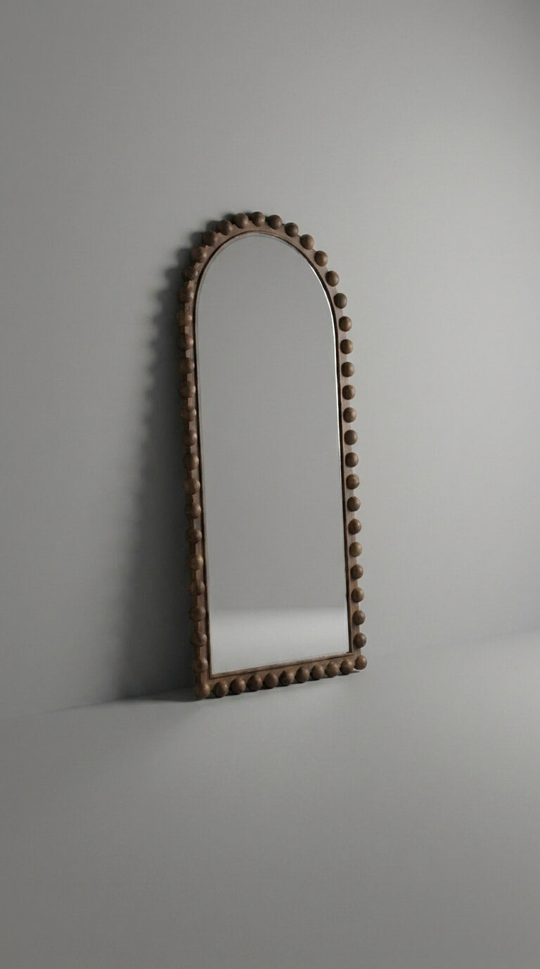 Decorative arch with a textured surface on a plain background